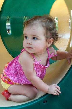 Milly on the playground at Greenfield Lake on her first birthday