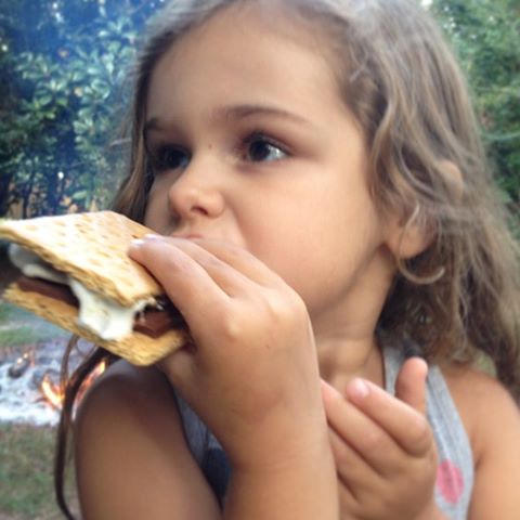 Milly eating a s'more